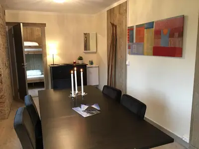a dining room with a table with candles on it at Kvamseter Lodge in Kvamseter