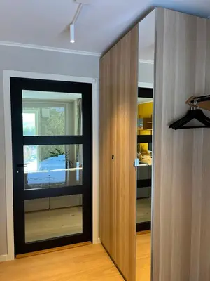a room with a door leading to a kitchen at Bosdalhuset in Lavik