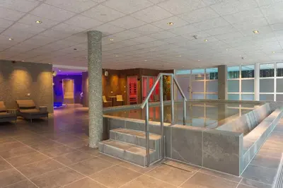 a lobby with a staircase in a building at Scandic Lillehammer Hotel in Lillehammer