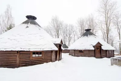 two wooden cabins with snow on their roofs at Scandic Lillehammer Hotel in Lillehammer