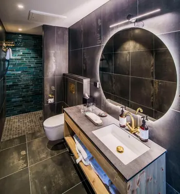 a bathroom with a sink and a toilet at Villa Vågå - by Classic Norway Hotels in Vågåmo