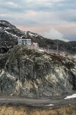 a house on top of a rocky mountain at Skarsnuten Mountain Resort & SPA in Hemsedal