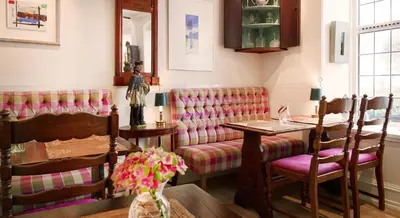 a dining room with a table and chairs at Hotel Park Bergen in Bergen