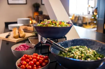 two bowls of salad on a counter with tomatoes at Thon Hotel Hallingdal in Ål