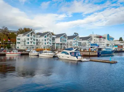 a group of boats are docked in a marina at Molde Fjordhotell - by Classic Norway Hotels in Molde
