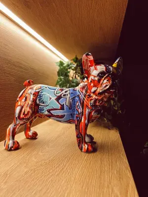 a figurine of a dog is sitting on the floor at Quality Hotel Panorama in Trondheim