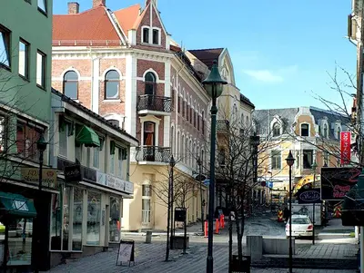 a city street with buildings and a street light at Grand Hotel Hønefoss in Hønefoss
