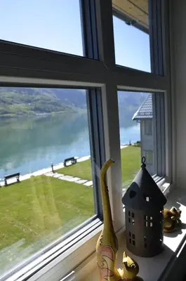 a window with a banana sitting on a window sill at Aga Fjord Apartments Hardanger in Nå