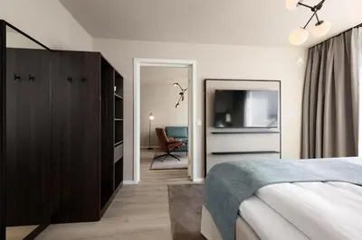 a bedroom with a bed and a television in it at Scandic Parken in Ålesund