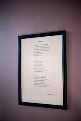 a framed picture of a document hanging on a wall at Askvoll Fjordhotell in Ask