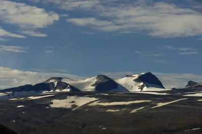a view of a mountain with snow on it at Strind Gard, Visdalssetra in Boverdalen