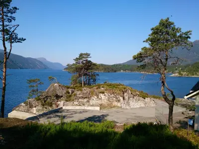 a view of a body of water with trees at Ropeid Villa Fjordferie in Ropeid