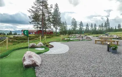 a miniature golf course with a flag and rocks at Gorgeous Apartment In Trysil With Sauna in Trysil