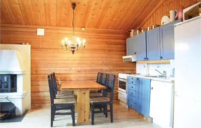 a dining room with a table and chairs in a kitchen at Gorgeous Apartment In Trysil With Sauna in Trysil