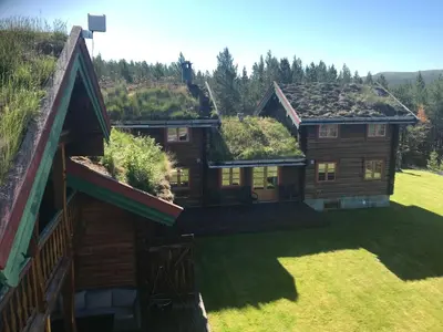 an image of a log cabin with a grass roof at Rondane Sollia Friluftsliv Øvre Nordli in Sollia