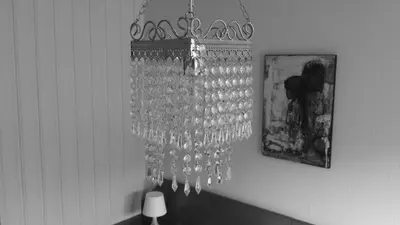 a bunch of wine glasses hanging from a wall at Skånevik Fjordhotel in Skånevik