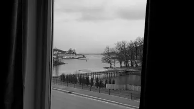 a view of a river from a window at Skånevik Fjordhotel in Skånevik