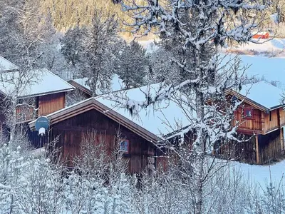 a log cabin with snow on the roof at 5 person holiday home in Ringebu-By Traum in Ringebu
