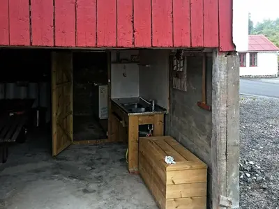 a kitchen with a counter and a sink in a building at 4 person holiday home in VEVANG-By Traum in Vevang
