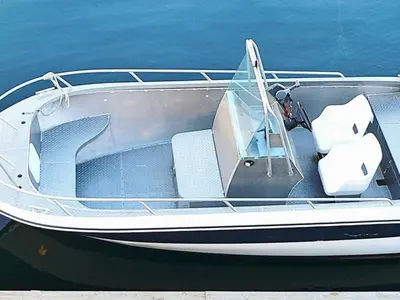 a boat sitting in the water on the water at 8 person holiday home in Sørbøvåg in Sørbø