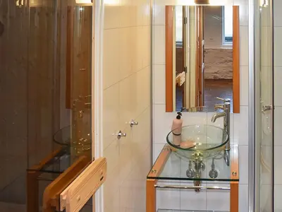 a bathroom with a glass bowl sink on a counter at 10 person holiday home in Folkestad in Folkestad