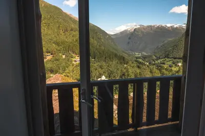 a view from a window of a mountain view at Blåtind Boutique Hotel in Stordal