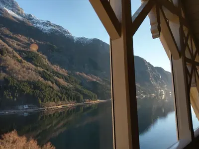 a view of a lake from a window at Vikinghaug in Odda