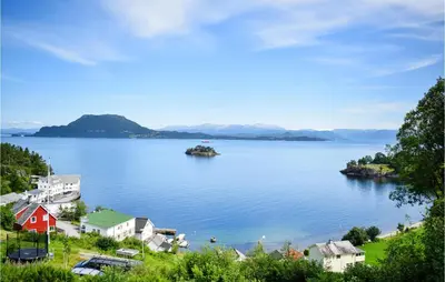 a view of a large body of water with houses at 3 Bedroom Stunning Home In Bjoa in Utbjoa