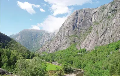 a mountain view of a valley with trees and a river at 3 Bedroom Lovely Home In Fjæra in Fjæra