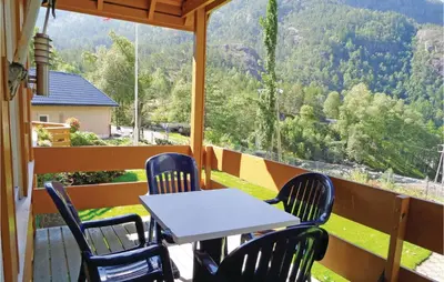 a table and chairs on a balcony with a view at 3 Bedroom Lovely Home In Fjæra in Fjæra