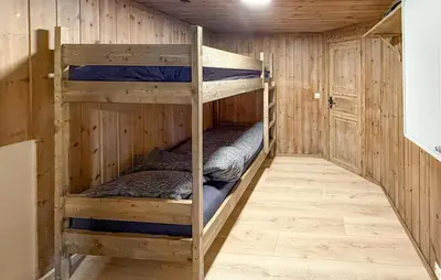 a bunk bed room with two bunk beds in it at Nice Home In Hovden With Sauna in Hovden