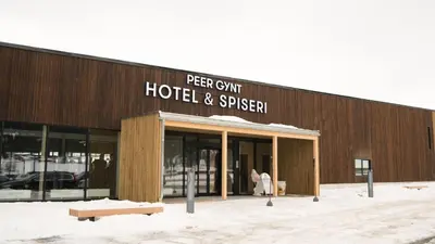 a building with a sign on the front of it at Thon Hotel Vinstra in Vinstra