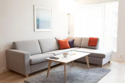 a living room with a couch and a coffee table at BJØRVIKA APARTMENTS, Damsgård Area, Bergen city center in Bergen
