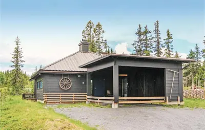 a small cabin with a large window on it at 3 Bedroom Stunning Home In Sjusjøen in Sjusjøen