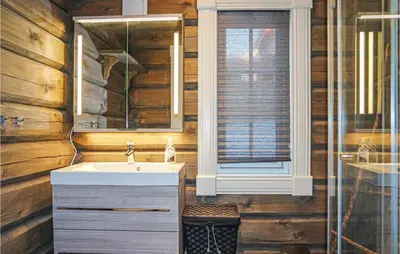 a bathroom with a sink and a mirror at Sjusjøen Setegrend 4733 in Sjusjøen
