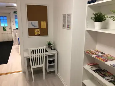 a white desk with a chair in a room at Vinstra Hostel in Vinstra