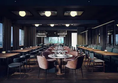 a long dining room with tables and chairs at Magic Kloverhuset Harbour Hotel, a member of Radisson Individuals in Bergen
