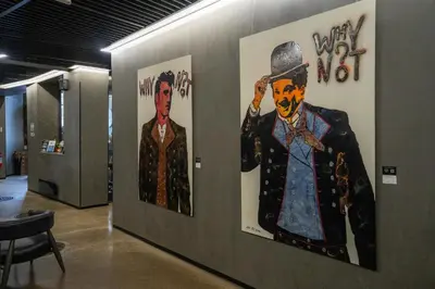 two posters of a man in a hat on a wall at Magic Hotel Bergen City Center, a member of Radisson Individuals in Bergen