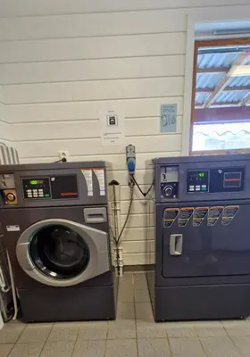 a washing machine and a washer in a room at Olden Camping in Olden