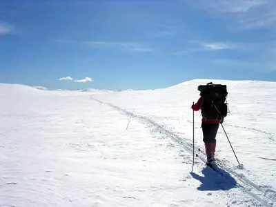 a person on skis in the snow with a backpack at Veggli Vertshus in Veggli