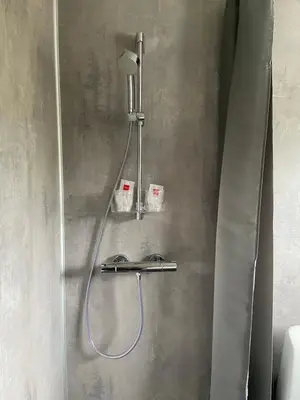 a shower in a bathroom with a shower head at Veggli Vertshus in Veggli