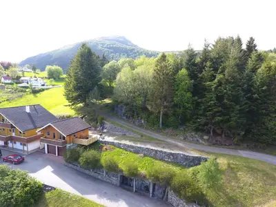 an aerial view of a house with a road at Holiday Home Kvernesfjorden in Averoy