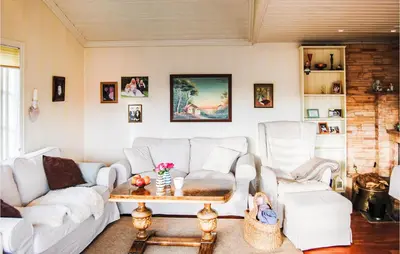 a living room with a white couch and chairs at Gorgeous Home In Førde I Hordaland in Førde