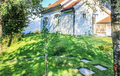 a small tree in front of a house at Gorgeous Home In Førde I Hordaland in Førde
