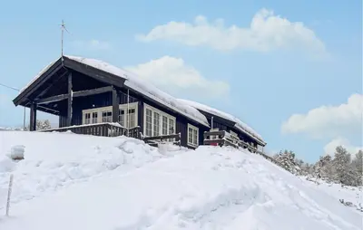 a house on top of a pile of snow at Amazing Home In Kvam With Kitchen in Kvam