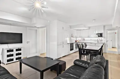 a living room with a couch and a table at Namsos Hybelhus in Namsos
