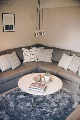 a living room with a couch and a table at Dalhus - House with jacuzzi in Norddal