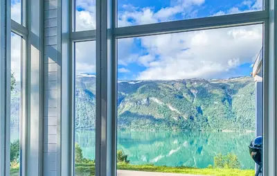 an open window with a view of a lake at Nice Home In Ornes With House Sea View in Ornes