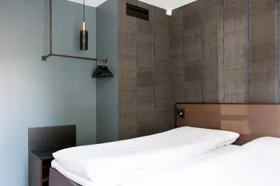 two beds sitting next to each other in a bedroom at Comfort Hotel Bergen in Bergen
