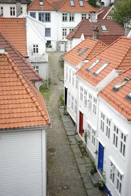 a row of white houses with orange roofs at Comfort Hotel Bergen in Bergen